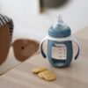 Láhev Bidon na učení pití 2v1 Learning Bottle 210ml Blue Beaba s modrým silikonovým obalem od 4 měsíců - Image 2